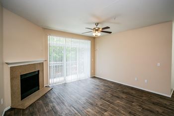 Faux Wood Floors in Spacious Floorplans with Ceiling Fan and Fireplace at Portland Townhome